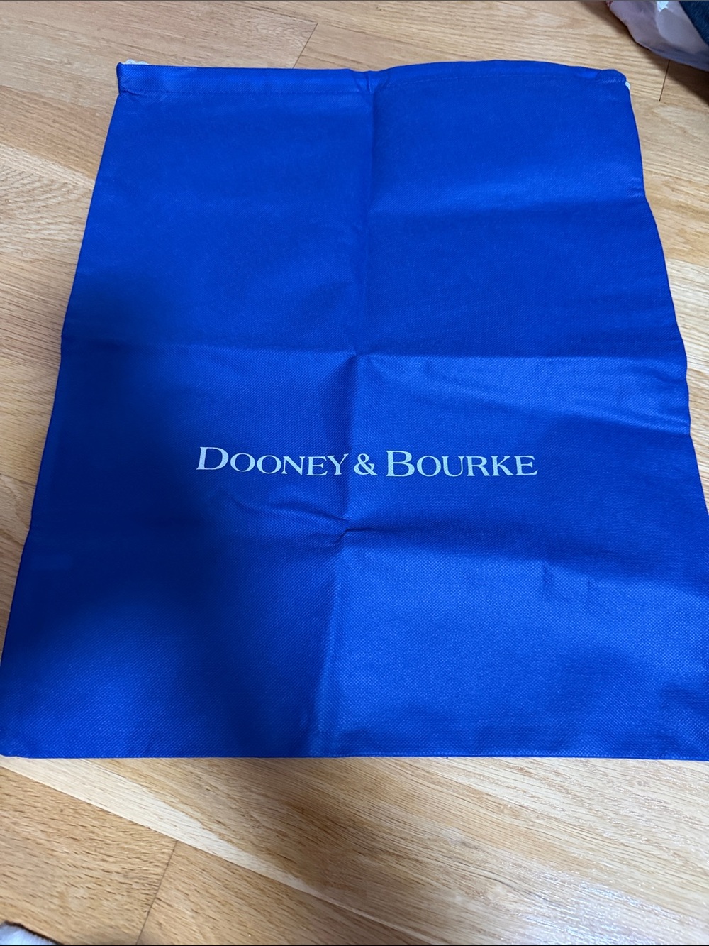 Dooney & Bourke Blue Drawstring Dust Big Bag with White Logo.